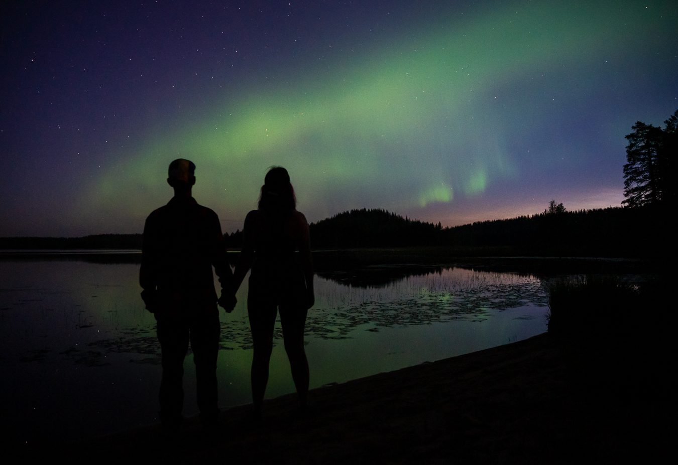 Taruma — northern lights over the lake in Kuhmo. Photo: Kerttu Komulainen.